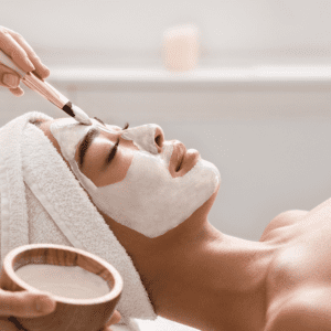 Person relaxing as they receive a holistic Wellness facial
